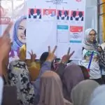 a group of people in front of a poster