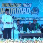 a man standing in front of a microphone